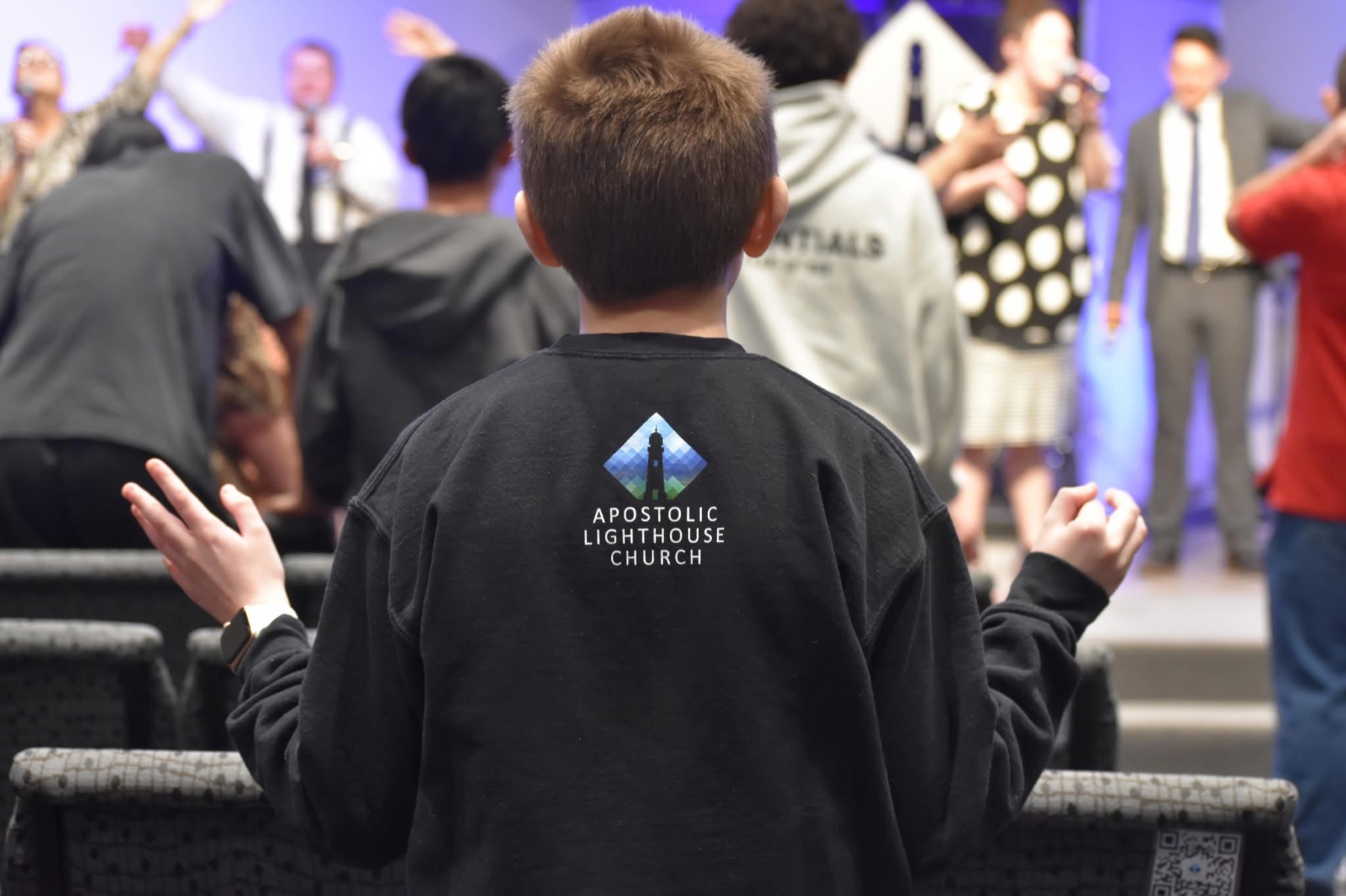 A young worshiper at Apostolic Lighthouse Church